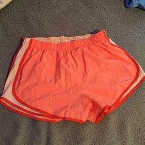 Orange Nike athletic shorts
